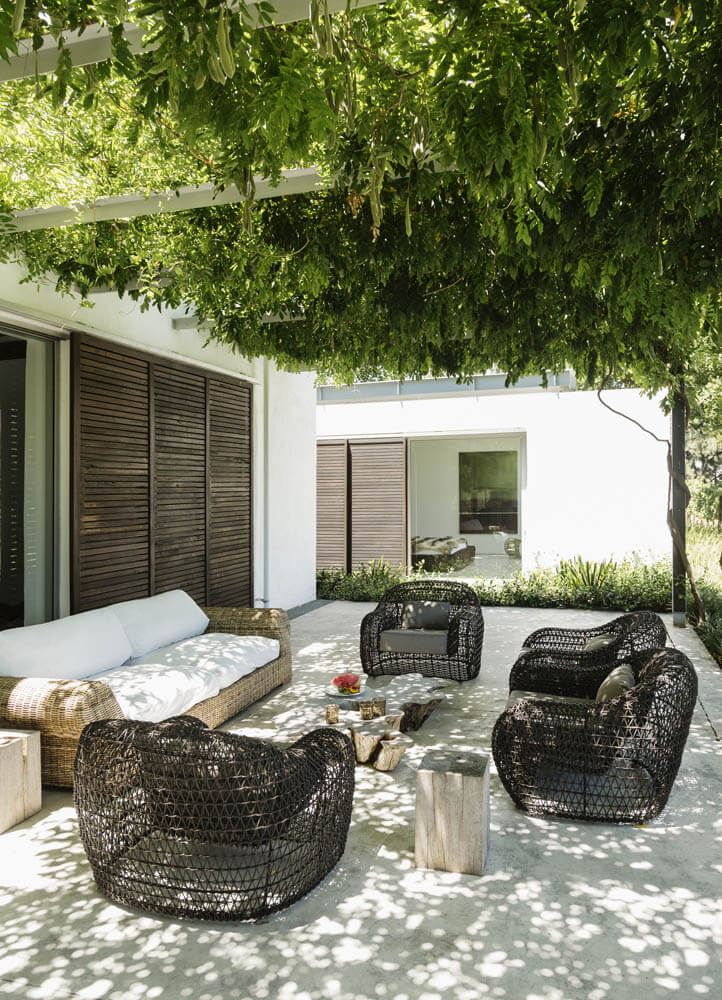 Armchairs and sofa on luxury patio
